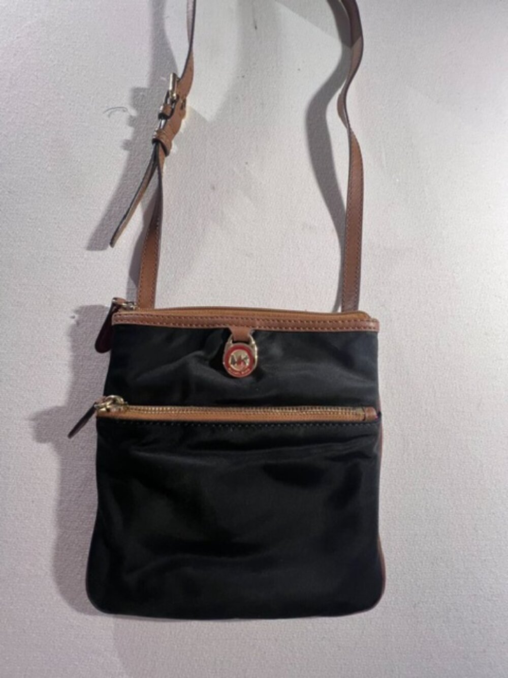 EXPRESS black faux leather crossbody‎ pink lining inside
